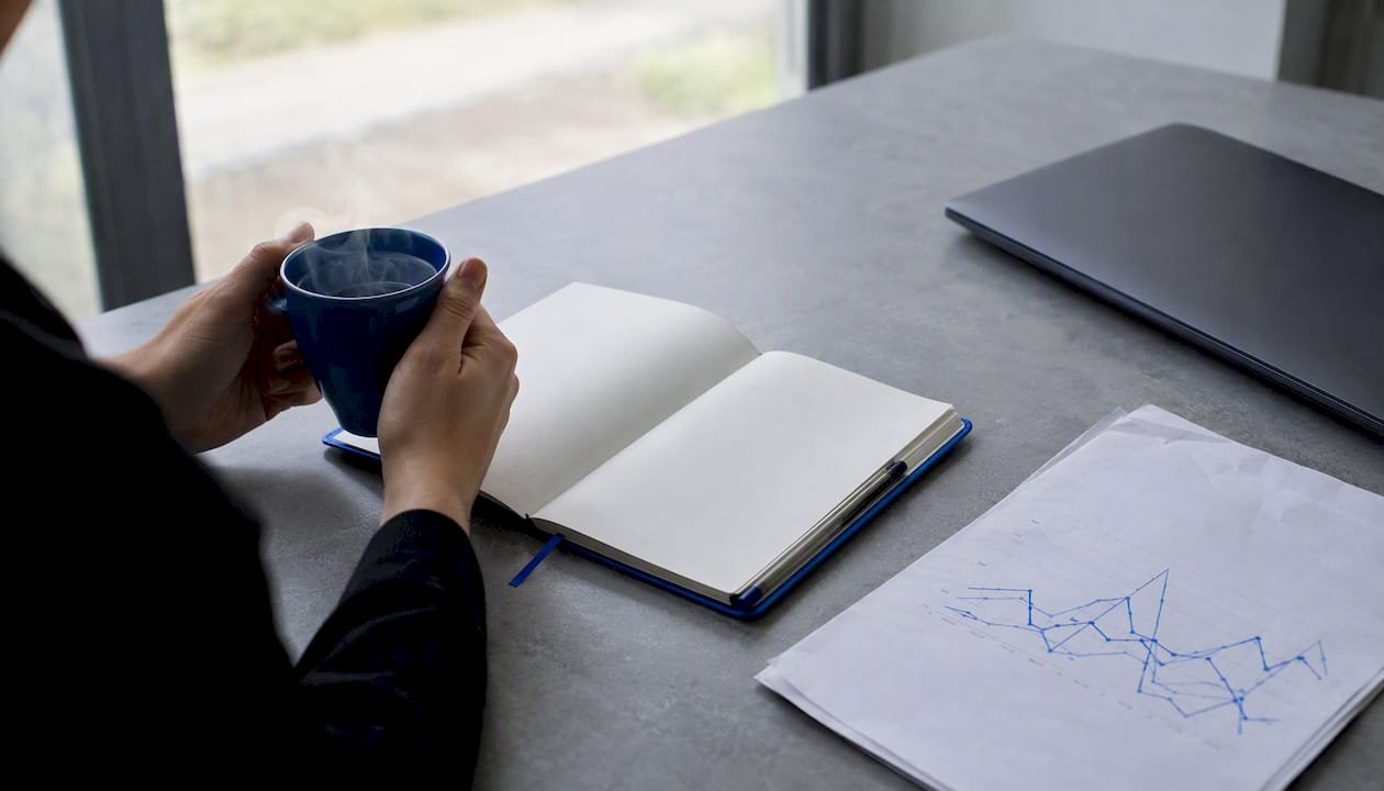 Workspace scene with keyword trend notes and coffee